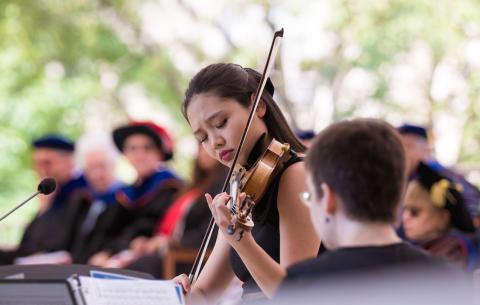Image of Shelley Choi playing the violin during the ceremony