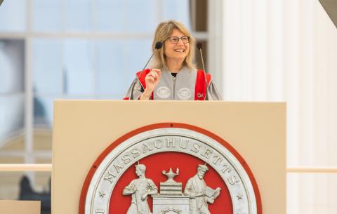Image of President Sally Kornbluth at the podium delivering her charge to the graduates