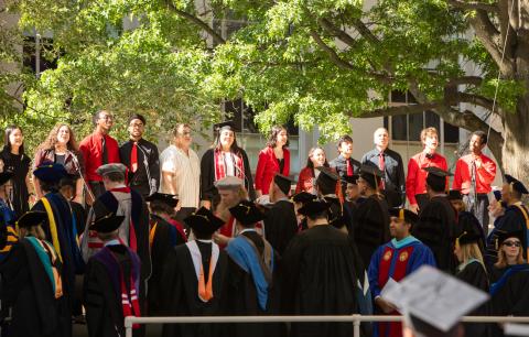 Image of the Chorallaries of MIT singing in unison