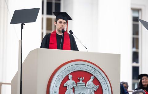 Image of Teddy Warner at the podium during the OneMIT Commencement Ceremony
