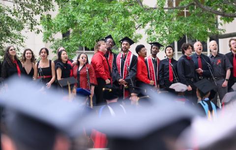 Image of the Chorallaries singing on stage