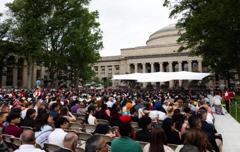 Image of the view from the audience on Killian Court looking towards the Commencement stage and the Building 10 Dome
